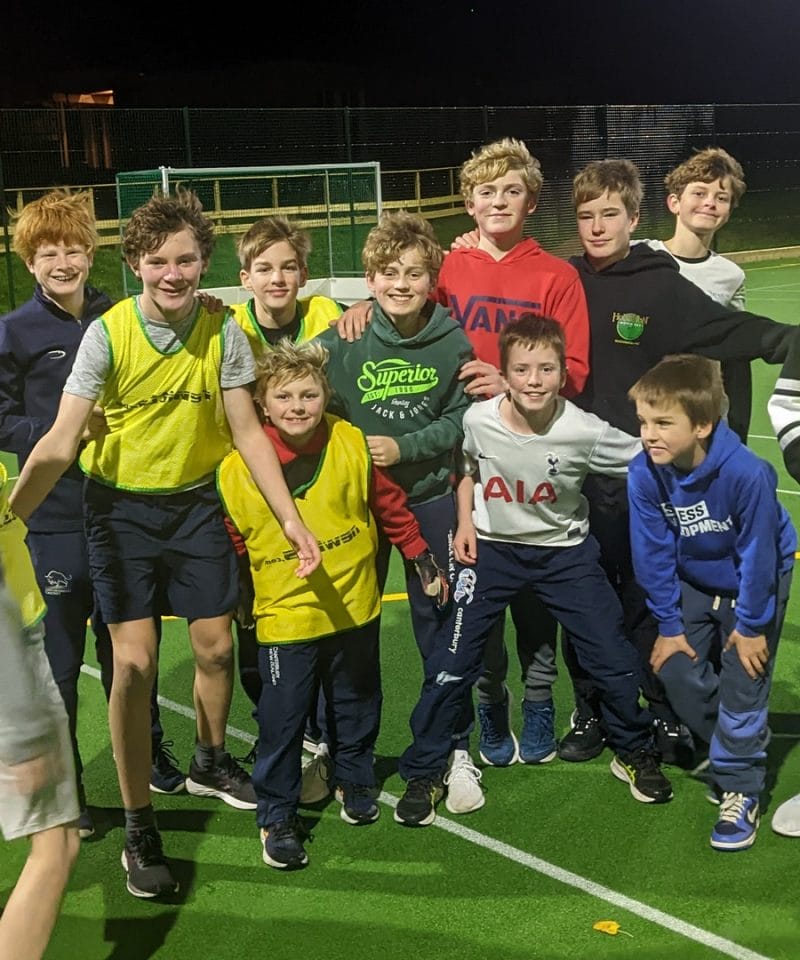 Pinewood boarders play under the floodlights on the new astro