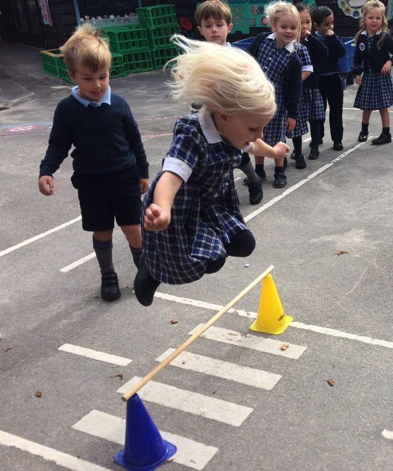 Pinewood Pre-Prep girl jumping in the playground