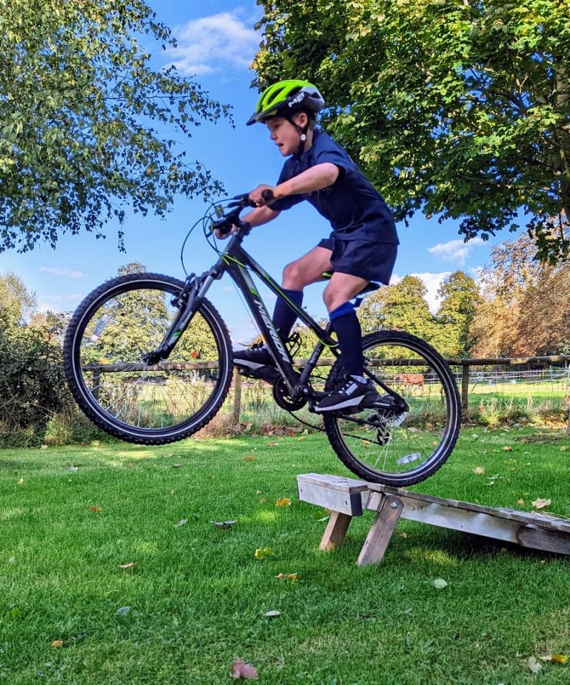Pinewood prep school boy in Mountain Biking activity
