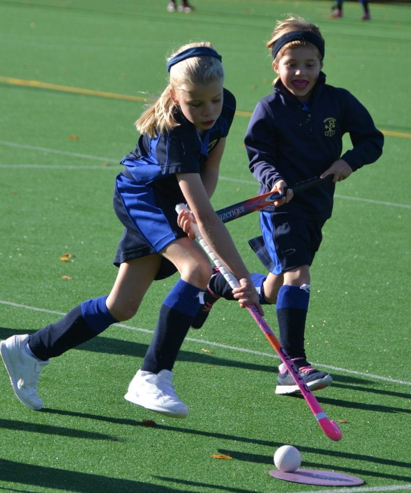 Pinewood prep school U8 girls playing hockey