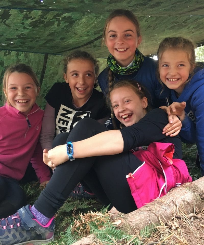 Pinewood prep school Year 6 girls under canvas on their Bushcraft adventure trip in Blenheim Woods